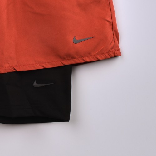 شورت رياضي مدمج بستريج قصير يغطي نصف الساق فصال اكثر من رائع  nike للجنسين برتقالي واسود